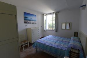 Tempat tidur dalam kamar di Agriturismo Serignano alle Rocchette