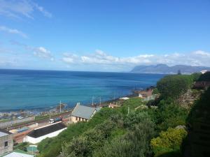 a view of the ocean from a hill at Seaview Apartment in Muizenberg in Muizenberg