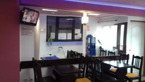 a dining room with a wooden table and chairs at Pensiune Turist in Sibiu