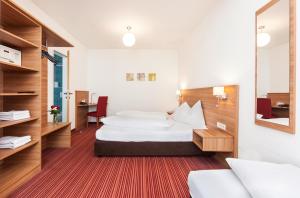 Katil atau katil-katil dalam bilik di Boutique Hotel Zach