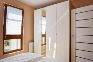 Posteľ alebo postele v izbe v ubytovaní Sun Apartament - Królewskie Kamieniczki
