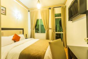 TV a/nebo společenská místnost v ubytování Hotel Borj Mogador