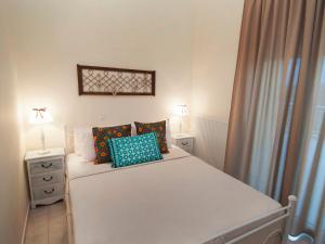 A bed or beds in a room at Villa Elaia Mare