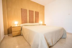 Ένα ή περισσότερα κρεβάτια σε δωμάτιο στο Apartamento Almunia +29 φωτογραφίες