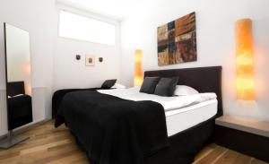 Postel nebo postele na pokoji v ubytování Máni Apartments