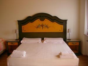Кровать или кровати в номере Agriturismo Al Dugale