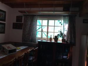 a dining room with a table and a window at Sitio da Paz Celestial in Nova Petrópolis +19 photos