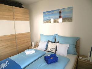 
Ein Bett oder Betten in einem Zimmer der Unterkunft Apartment Leuchtturm 16
