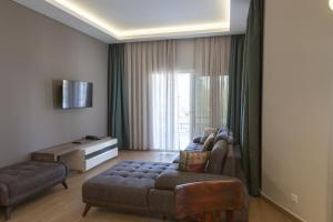 a living room with two couches and a couch at Sun Garden Apart Hotel in Yalıkavak