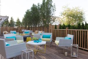 a group of chairs and tables on a deck at 21 Broad in Nantucket