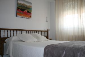 Posteľ alebo postele v izbe v ubytovaní Hostal Pereiriña