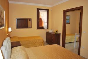 Uma cama ou camas num quarto em Vignali Residence