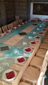a long table with chairs and wine glasses on it at Villa Carmela in Sessa Aurunca