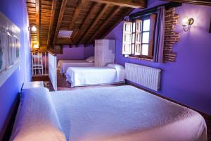 Säng eller sängar i ett rum på Viviendas Rurales Las Fontanias