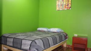 מיטה או מיטות בחדר ב-Hostal Aventura