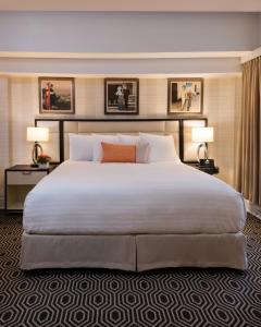 a large bed in a hotel room with two lamps at Inn at Union Square in San Francisco
