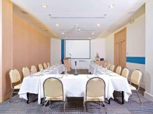 a conference room with a long table and chairs at Ibis Phuket Kata in Kata Beach