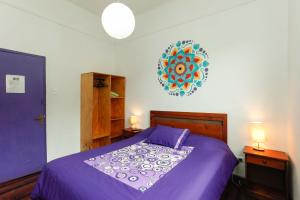 Rúm í herbergi á Casa Violeta Limón