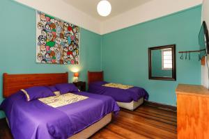 Rúm í herbergi á Casa Violeta Limón