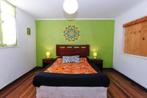 Rúm í herbergi á Casa Violeta Limón
