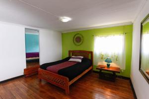 Rúm í herbergi á Casa Violeta Limón