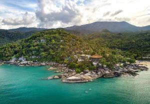 an island in the middle of a body of water at Panviman Resort Koh Phangan - SHA Extra Plus in Thong Nai Pan Noi