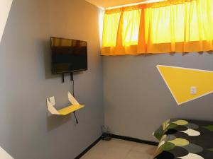 TV a/nebo společenská místnost v ubytování B&B México Roma Norte