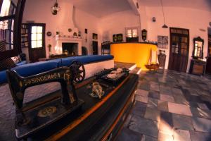a living room with a bed in a room at Vagia Traditional, Aegina Island in Vaia