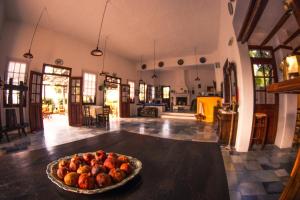 a bowl of fruit on a table in a kitchen at Vagia Traditional, Aegina Island in Vaia