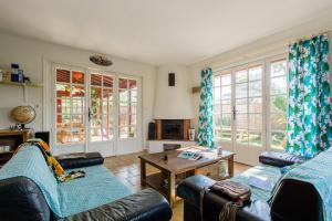 a living room with two couches and a table at Nami House in Anglet