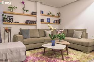 a living room with a couch and a table at Marianna Hotel in Alexandroupoli