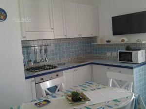 A kitchen or kitchenette at Residenza del Mare & SPA