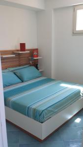 Een bed of bedden in een kamer bij Residenza del Mare & SPA