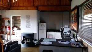 a kitchen with a sink and a counter top at Blarney Stone Cottage in Killarney