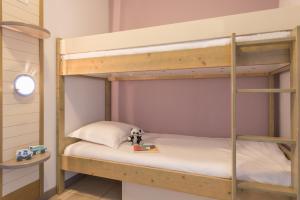Postel nebo postele na pokoji v ubytování Résidence Pierre & Vacances La Rostagne
