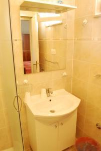 a bathroom with a sink and a mirror at Rooms Villa Andreja in Pag +53 photos
