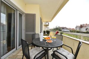 Un balcón o terraza de Adria Apartments
