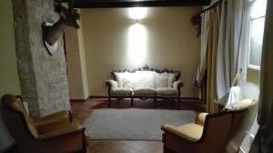 a living room with a couch and two chairs at Villa Colticciola Agriturismo Marche in Cagli