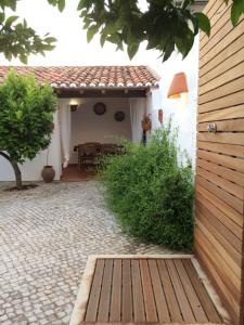 an external view of a house with a patio at Casa da Galega in Golegã