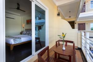 Postel nebo postele na pokoji v ubytování Grand Bayon Siem Reap Hotel
