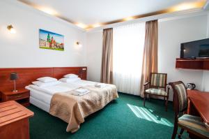Cama ou camas em um quarto em Hotel Artur
