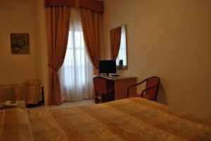 Letto o letti in una camera di Hotel Tre Torri