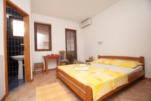 Posteľ alebo postele v izbe v ubytovaní Apartments Pinus