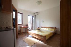 Posteľ alebo postele v izbe v ubytovaní Apartments Pinus