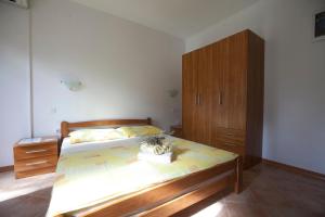 Posteľ alebo postele v izbe v ubytovaní Apartments Pinus