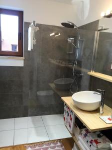 a bathroom with a sink and a shower at Apartamenty Flaming Baltic Park Stegna in Stegna +32 photos