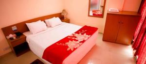 Llit o llits en una habitació de Praasad Paradise