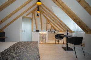 a room with a bed and a table and chairs at Situs Residence in Split