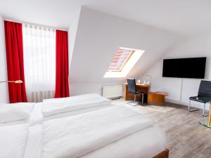 Postel nebo postele na pokoji v ubytování DORMERO Hotel Dresden Airport