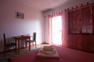Posteľ alebo postele v izbe v ubytovaní Apartments Pinus